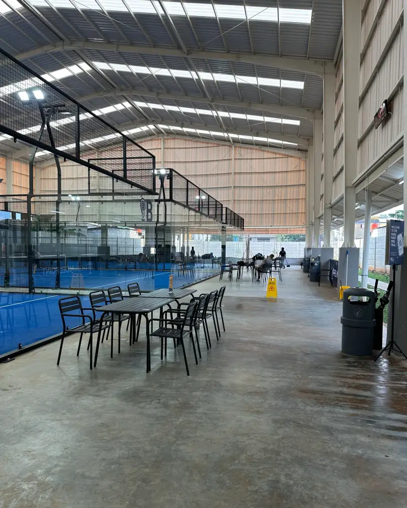 Courtside tables beside the glass