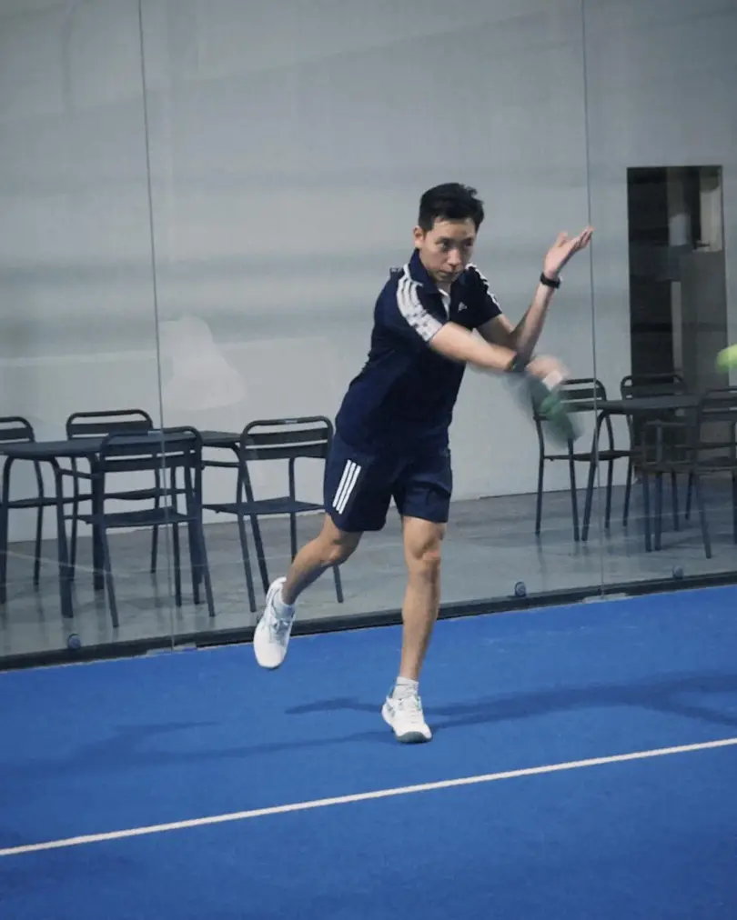 A player hitting a forehand
